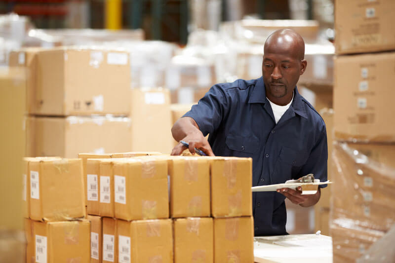 Person inspecting shipping boxes in Richmond VA